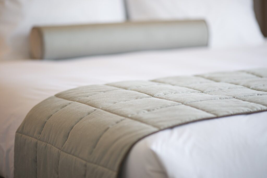 close up gray blanket bed