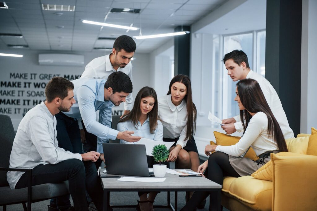 guy shows document girl group young freelancers office have conversation working.jpg